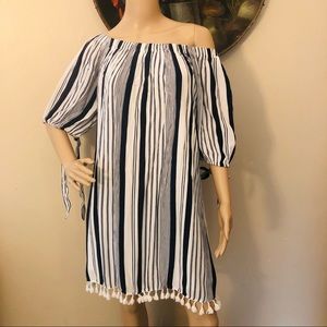 Speed control dress with tie sleeves and tassels.